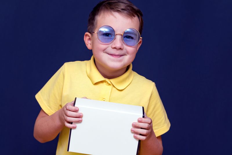 boy with color blindness correction glasses