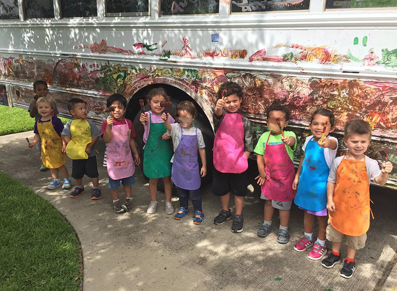 Sugar Mill Montessori Students painting a bus