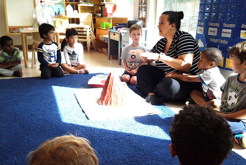 Students and teacher learning and playing together at Sugar Mill Montessori School