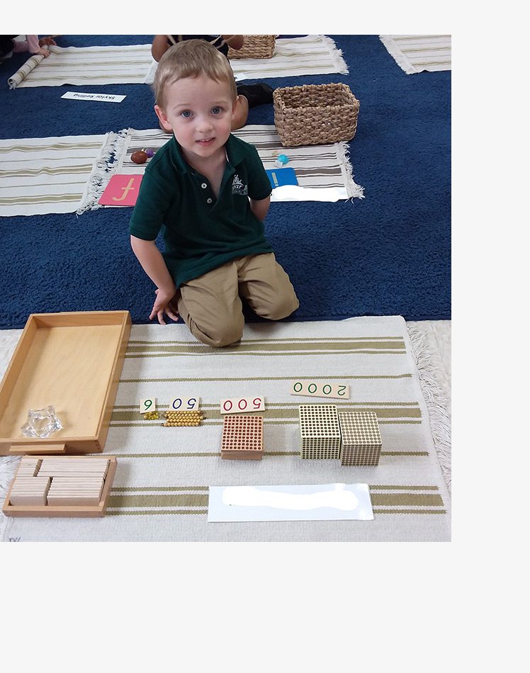 Student playing with numbers at Sugar Mill Montessori School