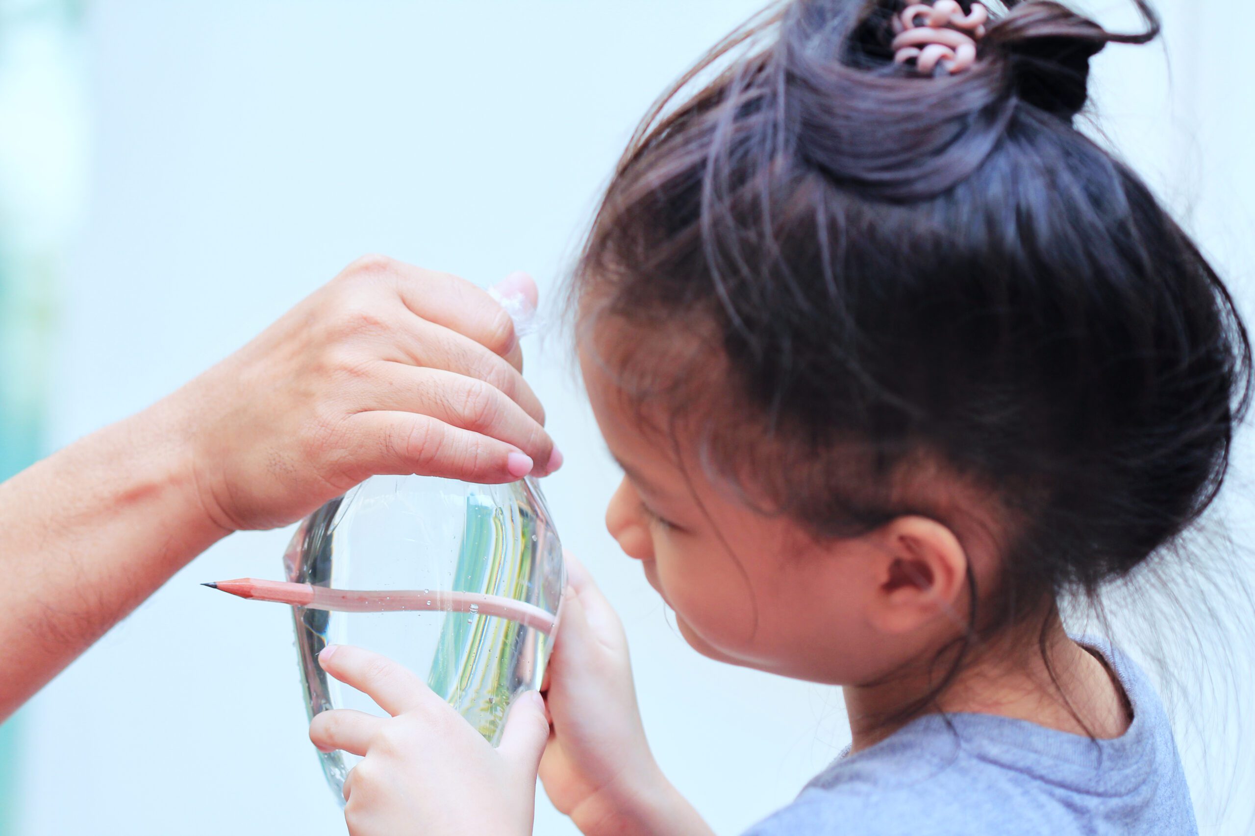 little girl doing the leak-proof bag experiment