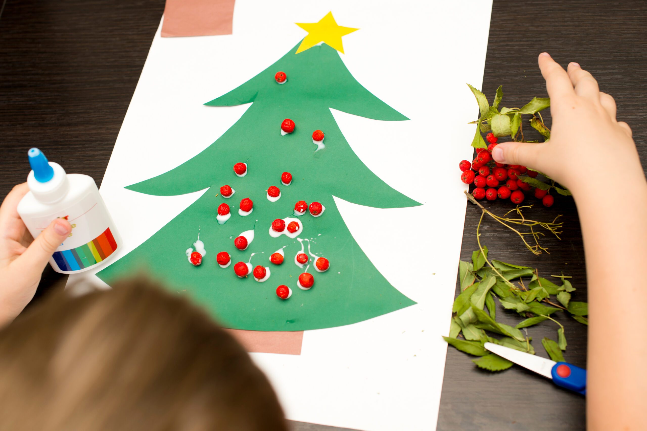 child making holiday arts and crafts